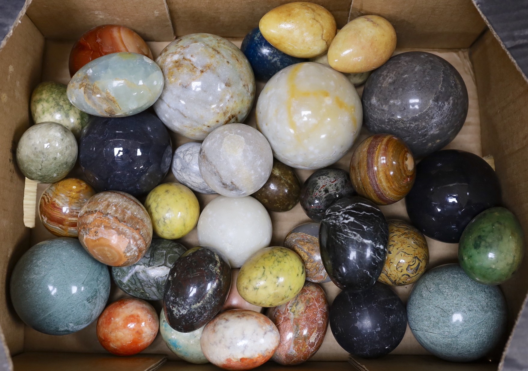 A quantity of marble eggs and balls